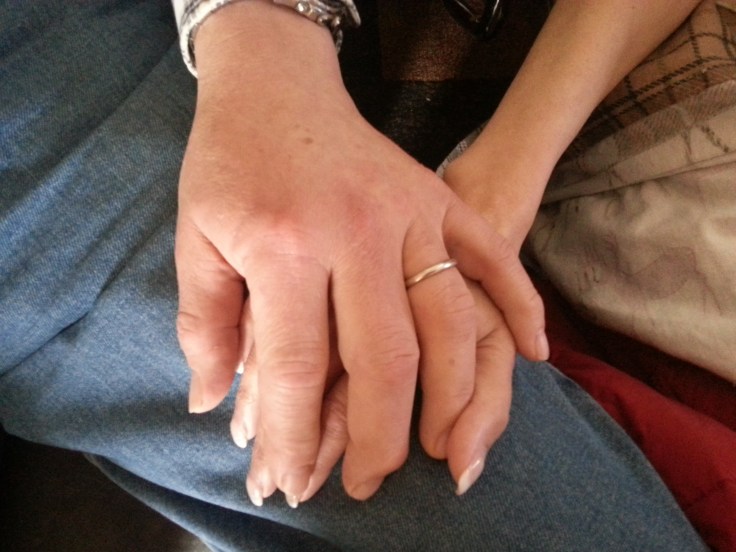 A time we will never forget - Big brother Tom holding Eileen's hand